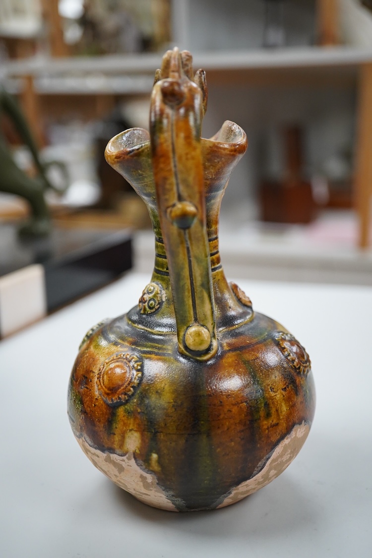 A Chinese pottery jug, two hardstone discs and a metal seal. Jug 17.5cm high